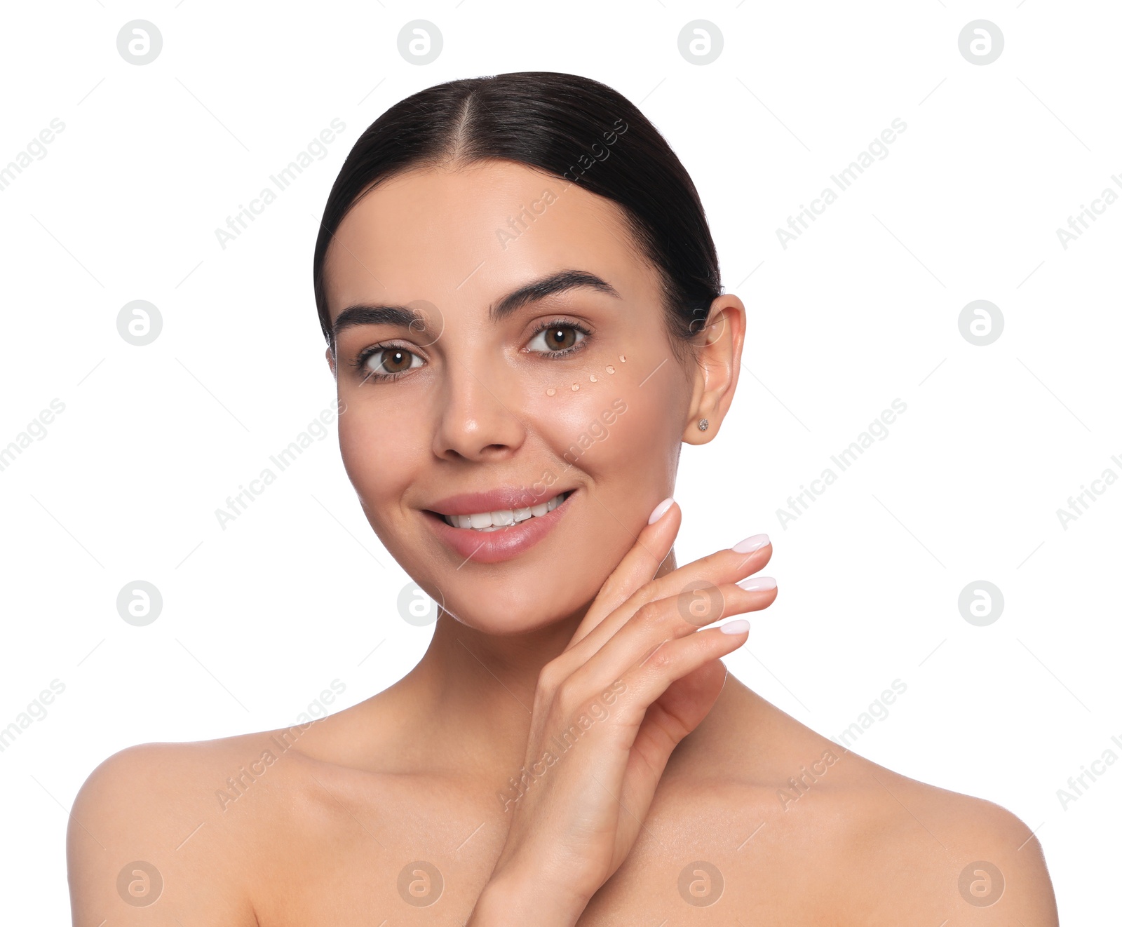 Photo of Beautiful young woman with gel on skin under eye against white background