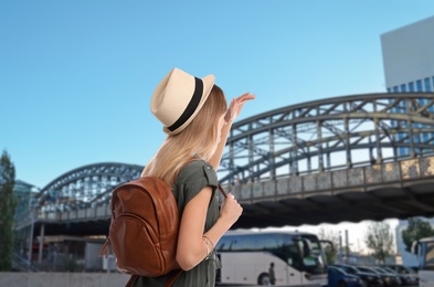 Traveler with backpack in foreign city during summer vacation