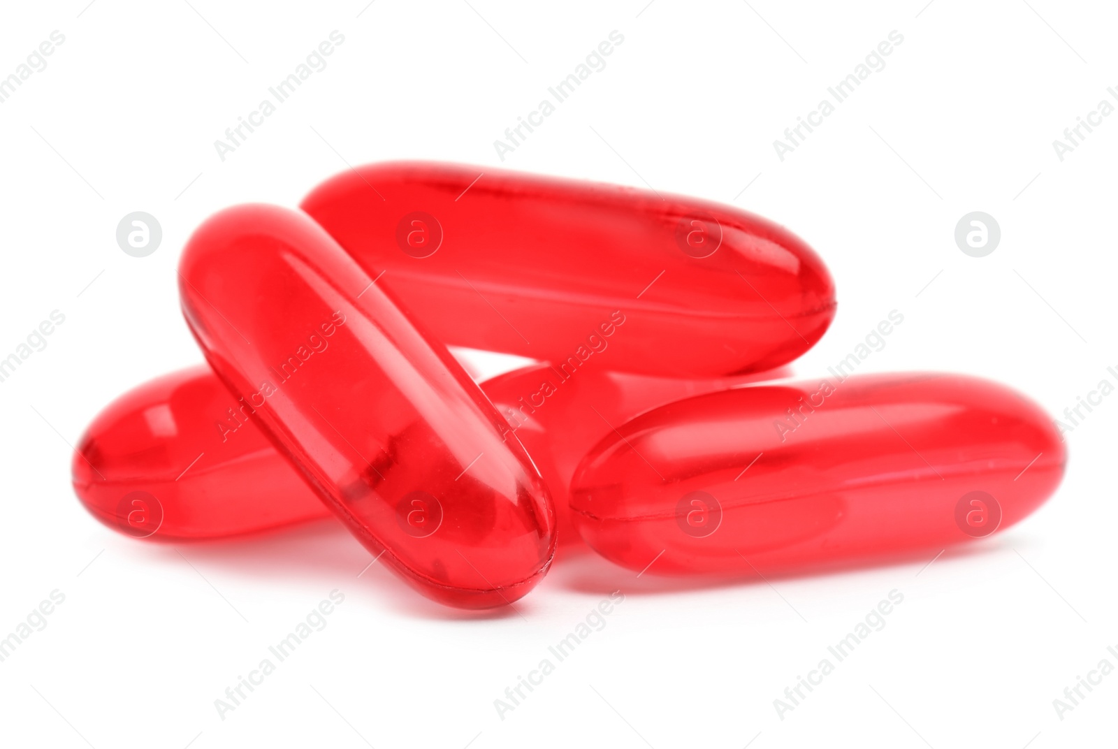 Photo of Pile of color pills on white background