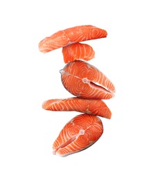 Image of Cut fresh salmon falling on white background