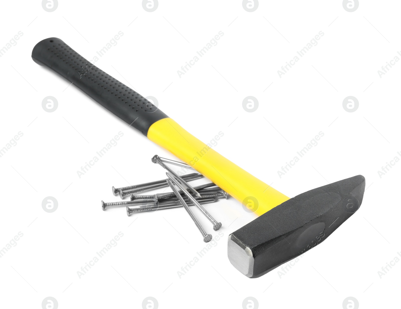 Photo of Hammer and metal nails isolated on white