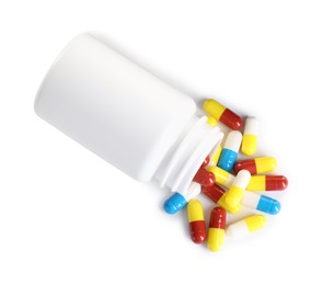 Antibiotic pills and bottle isolated on white, top view