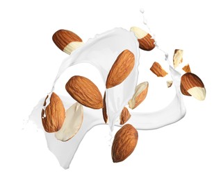 Image of Delicious almond milk and nuts on white background