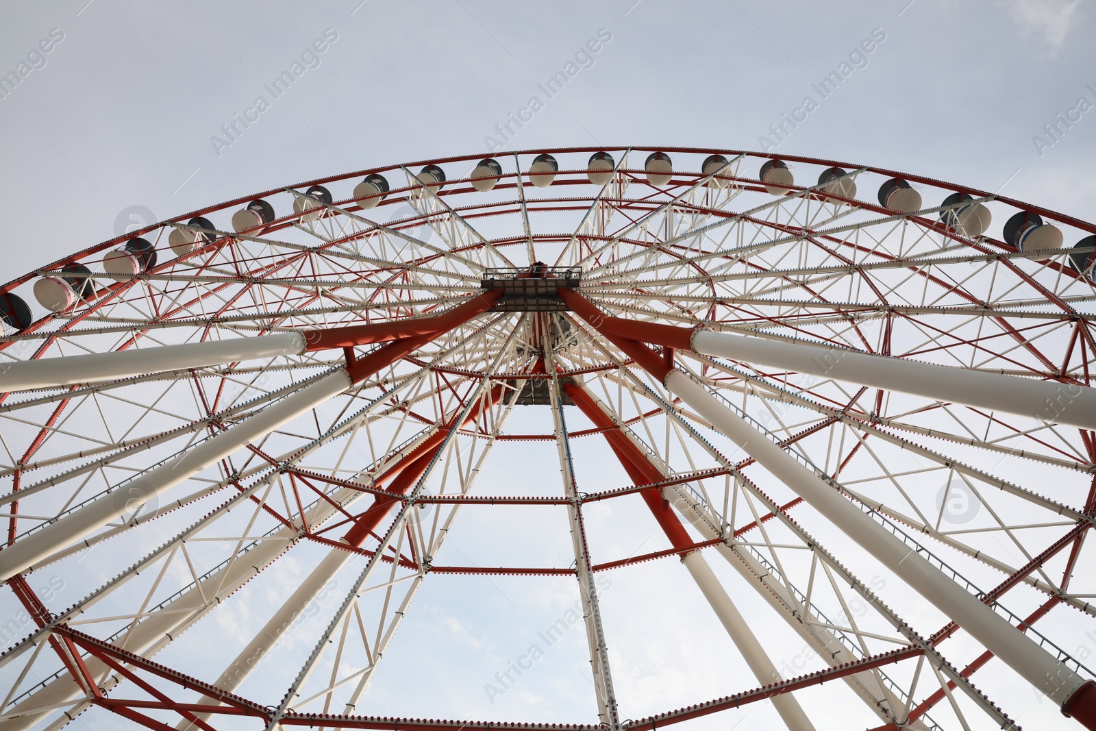 Photo of Beautiful large Ferris wheel outdoors, low angle view