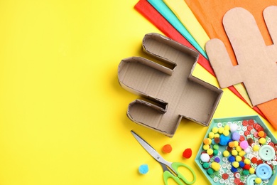 Photo of Materials and tools on yellow background, flat lay with space for text. Cactus pinata DIY