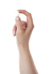 Photo of Woman holding vitamin capsule on white background, closeup. Health supplement