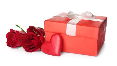 Photo of Beautiful gift box, roses and red heart on white background. Valentine's day celebration