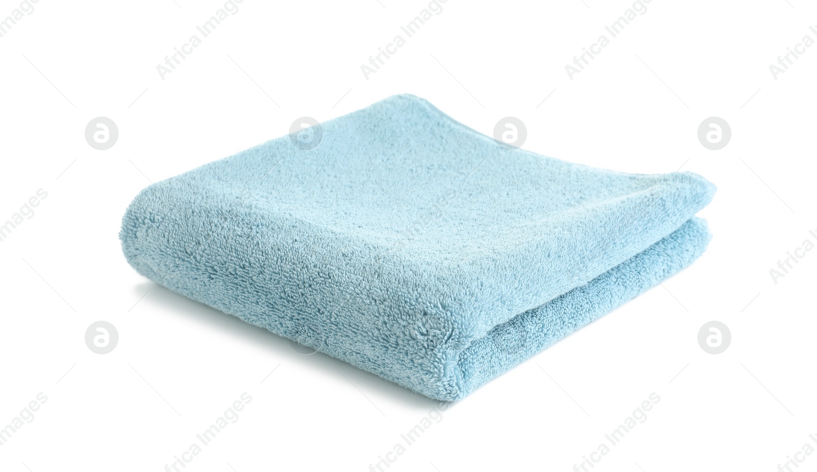 Photo of Folded soft terry towel on white background