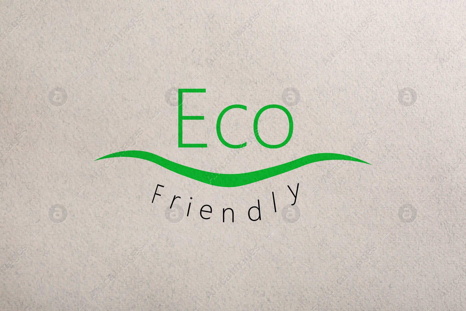 Image of Phrase Eco Friendly written on recycled paper, top view