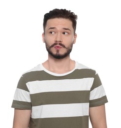 Portrait of embarrassed man on white background