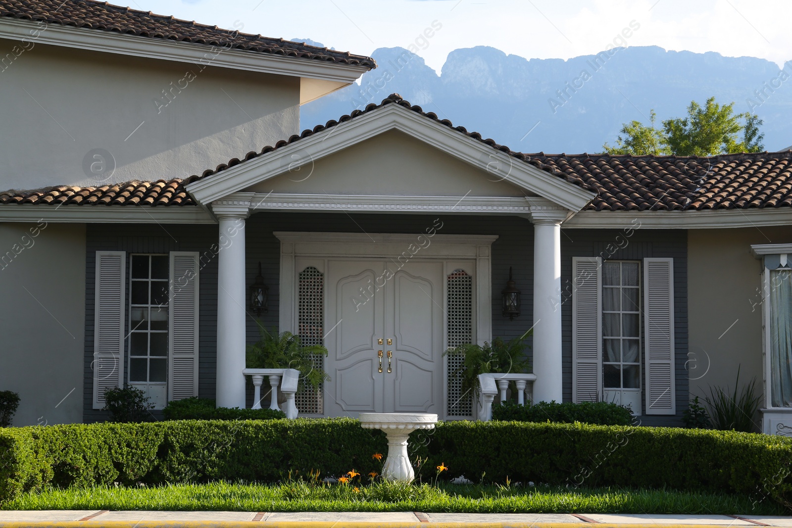 Photo of Exterior of beautiful modern house in city street