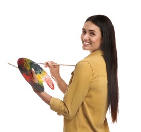 Photo of Young woman drawing with brush on white background