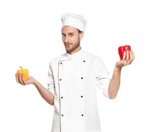 Professional chef holding peppers on white background