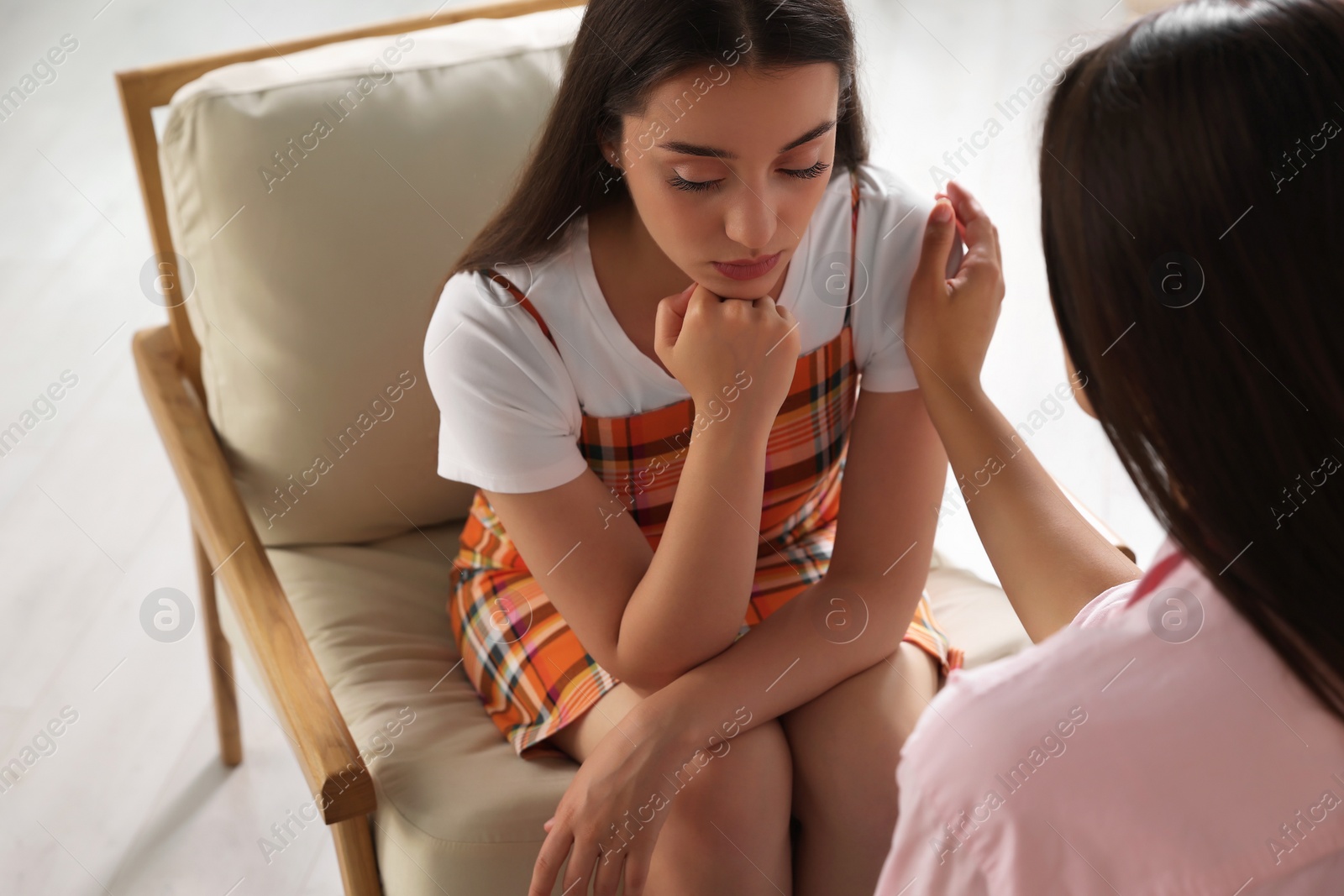 Photo of Professional psychologist working with young woman in office