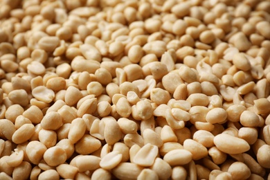 Photo of Dry shelled peanuts as background. Healthy snack