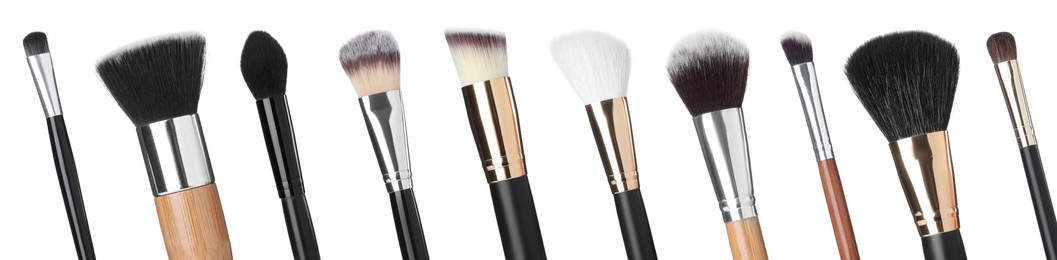 Image of Set with different makeup brushes for applying cosmetic products on white background, banner design