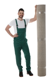 Photo of Male worker with rolled carpet on white background