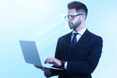 Facial recognition system. Man using laptop on light blue background 