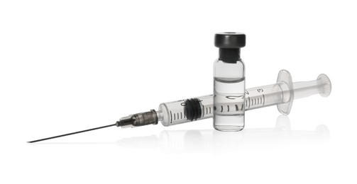 Photo of Syringe with vial of medicine isolated on white