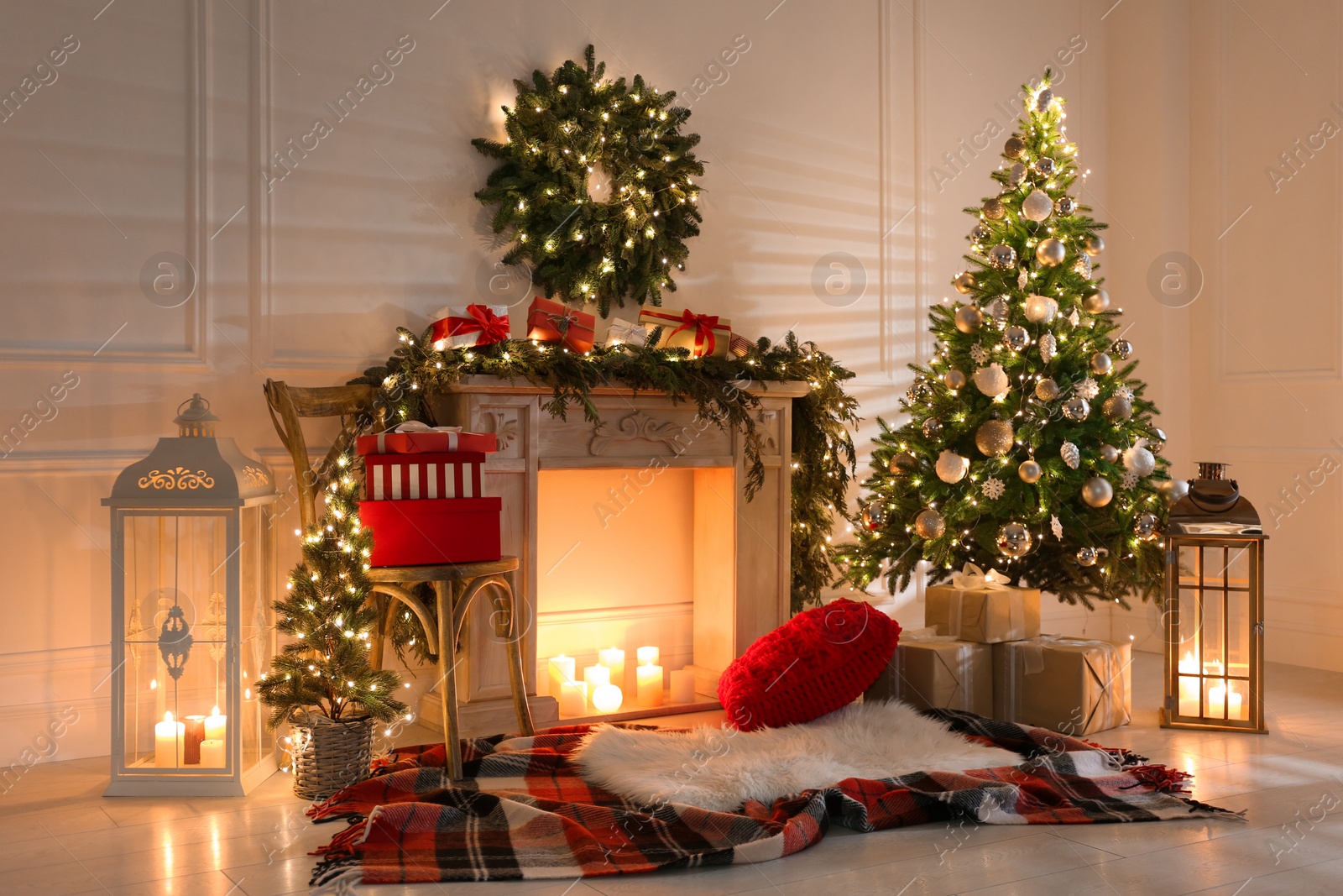 Photo of Beautiful Christmas themed photo zone with fireplace and fir decor