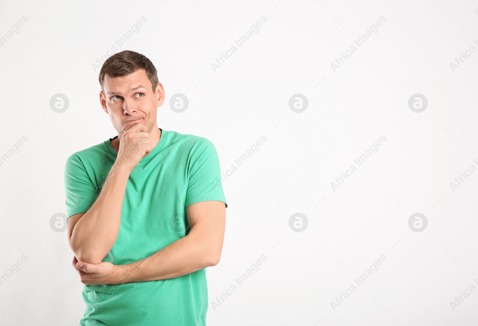 Photo of Emotional man in casual outfit on white background