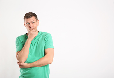 Emotional man in casual outfit on white background