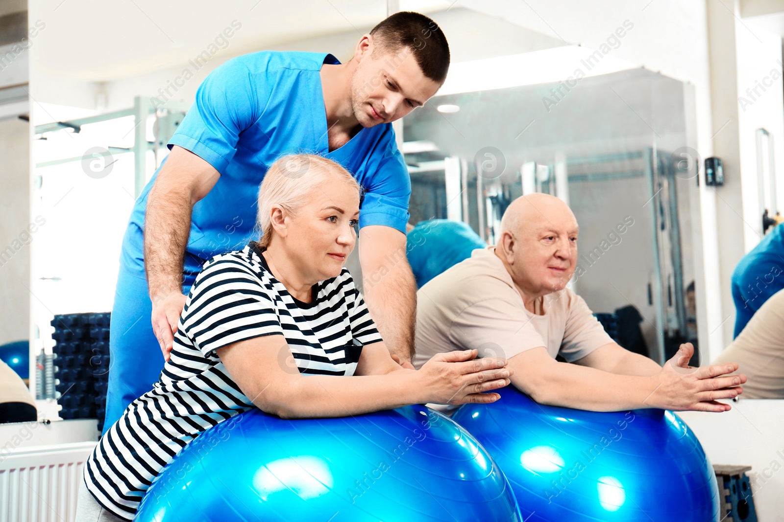 Photo of Patients exercising under physiotherapist supervision in rehabilitation center