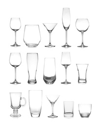 Image of Set of different empty glasses on white background