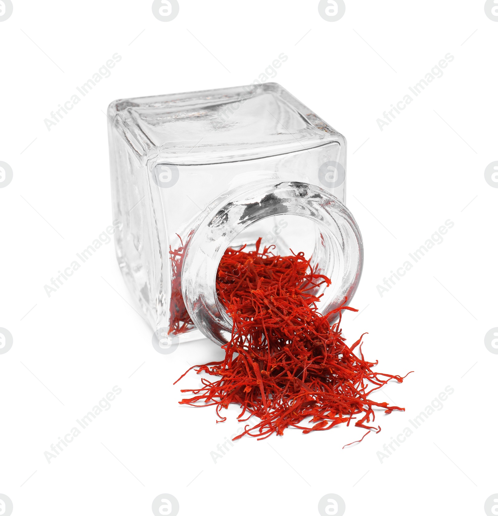 Photo of Aromatic saffron and glass jar isolated on white