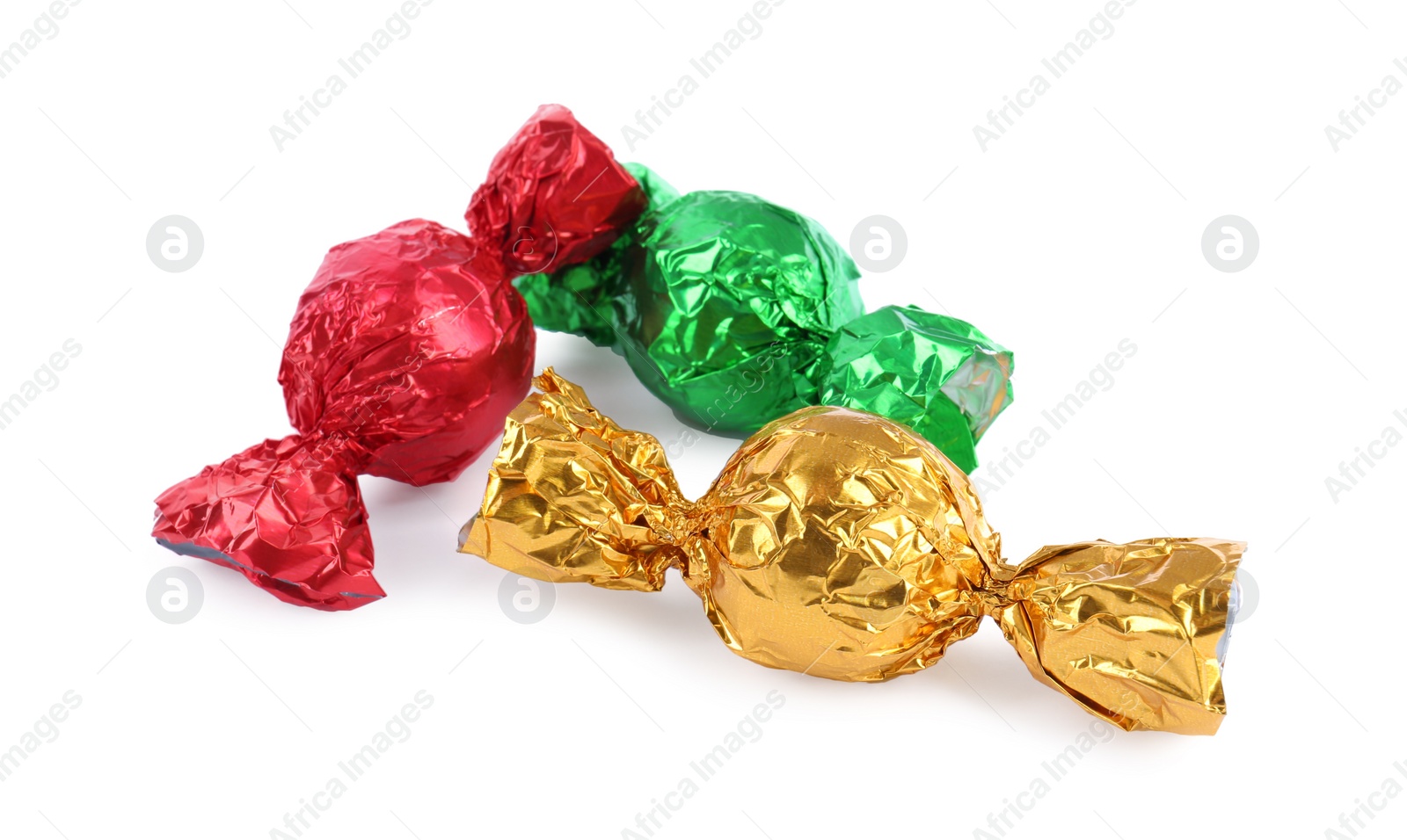 Photo of Tasty candies in colorful wrappers isolated on white