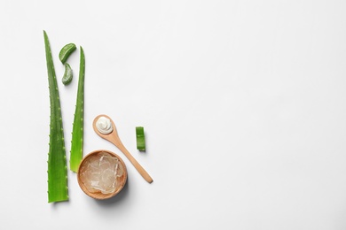 Flat lay composition with aloe vera on white background. Space for text