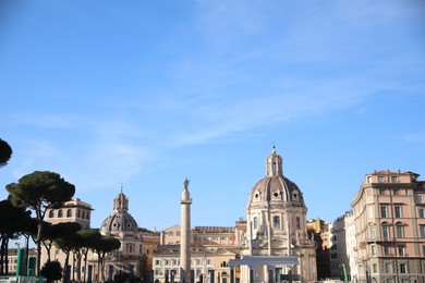 Photo of Rome, Italy - February 4, 2024 : Church of Most Holy Name of Mary and Trajan's Column outdoors
