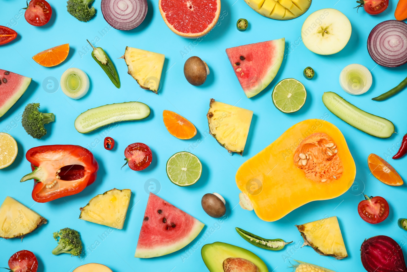 Photo of Flat lay composition with fresh organic fruits and vegetables on light blue background