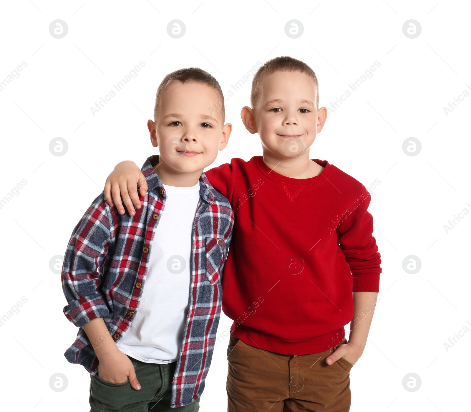 Photo of Portrait of cute twin brothers on white background