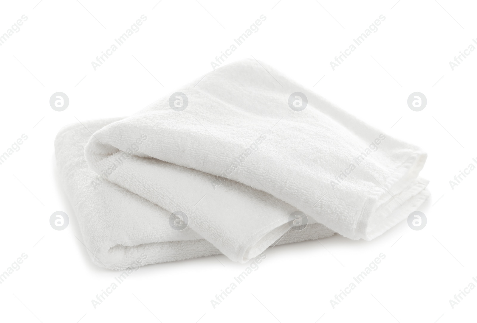 Photo of Folded clean soft towels on white background