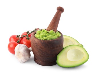 Photo of Mortar with delicious guacamole and ingredients isolated on white