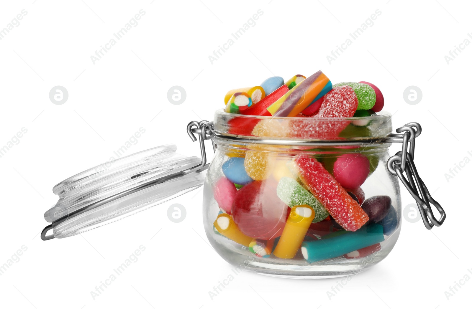 Photo of Many different candies in glass jar isolated on white