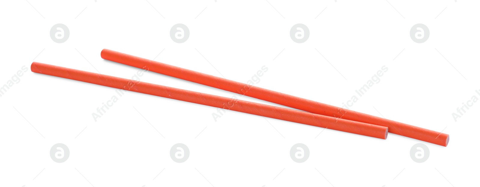 Photo of Orange paper cocktail straws on white background