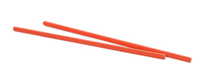 Photo of Orange paper cocktail straws on white background