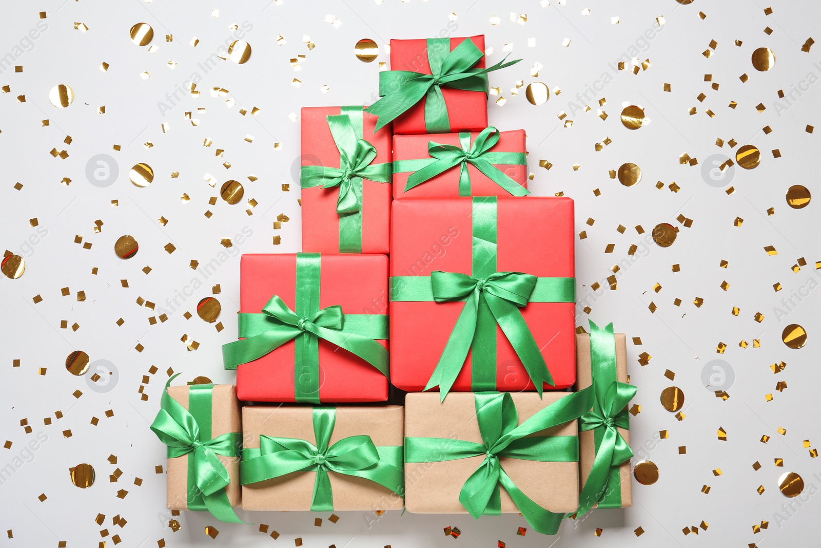 Photo of Christmas tree made with different gift boxes on white background, flat lay