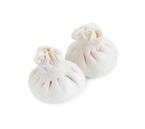 Photo of Uncooked khinkali (dumplings) isolated on white. Georgian cuisine