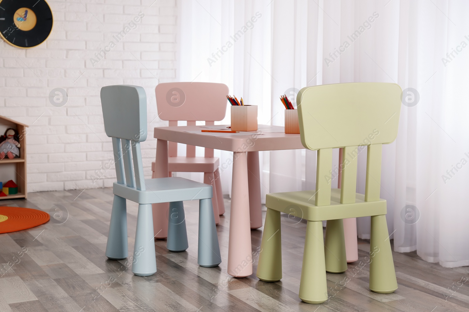 Photo of Modern child room interior with table and chairs