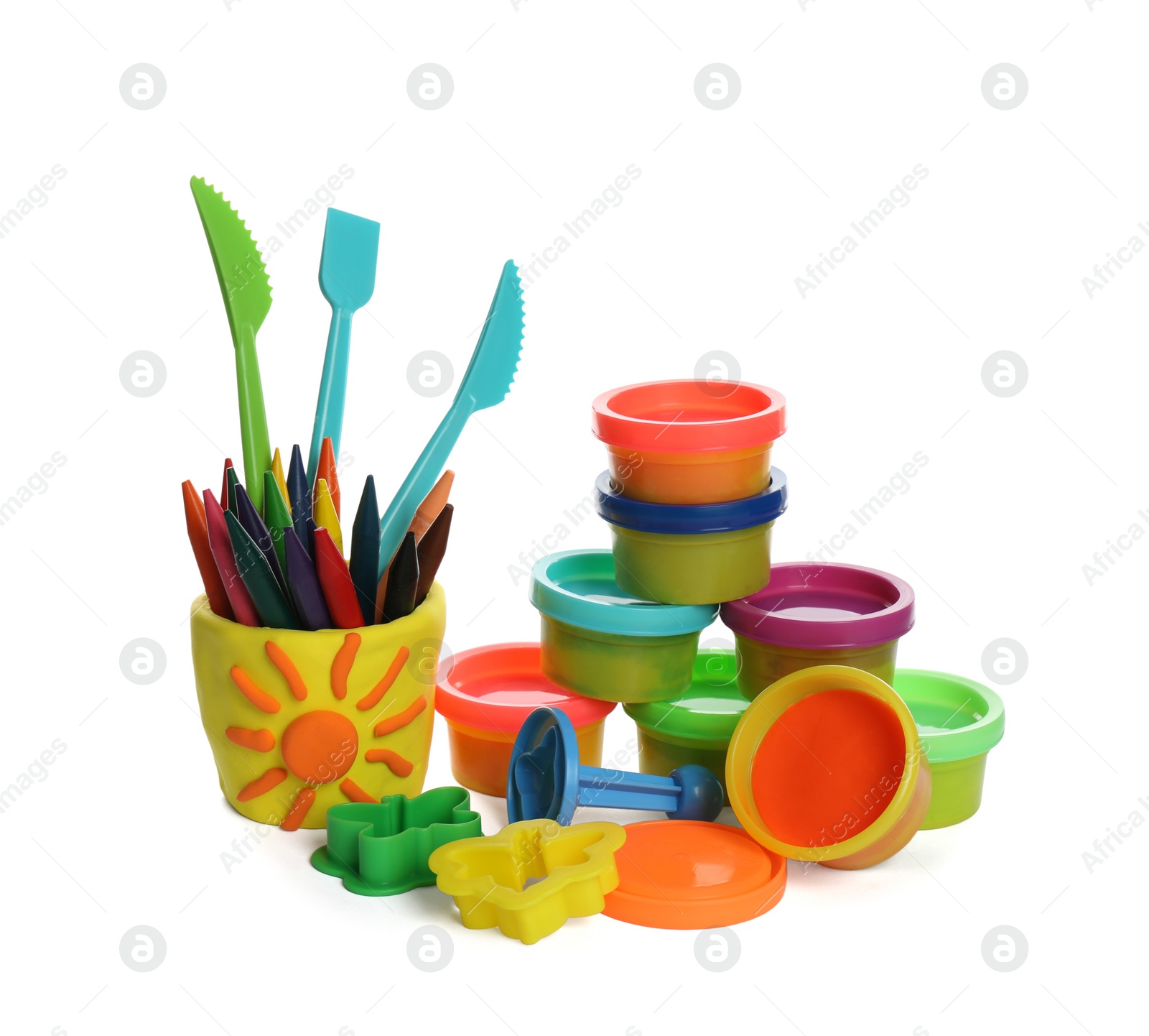 Photo of Set of bright play dough with tools and colorful pencils on white background