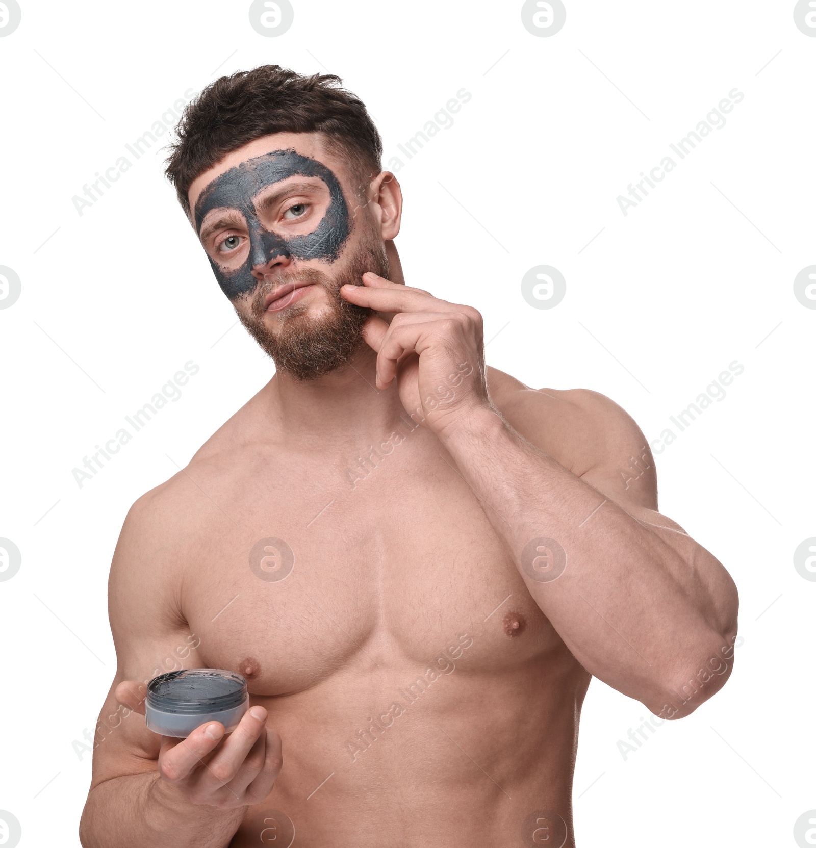 Photo of Handsome man with clay mask on his face against white background