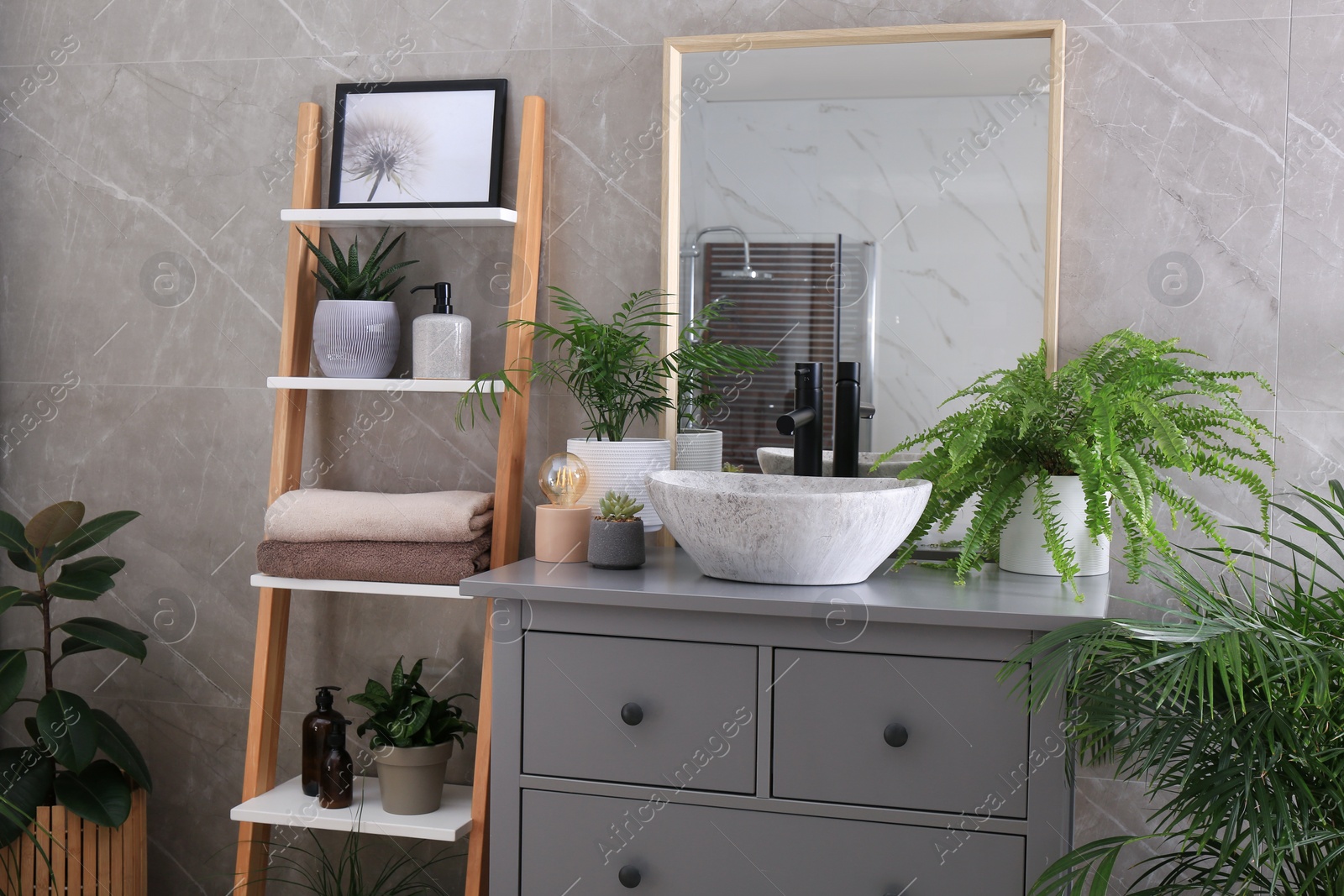 Photo of Modern bathroom interior with stylish vessel sink and beautiful green houseplants