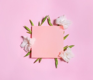 Photo of Beautiful gladiolus flowers and blank card on pink background, flat lay. Space for text