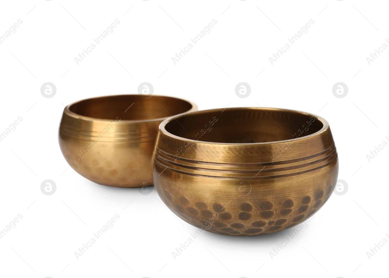 Photo of Two Tibetan singing bowls on white background