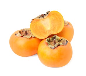 Photo of Whole and cut delicious ripe juicy persimmons on white background