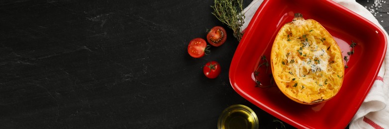 Half of cooked spaghetti squash with cheese in baking dish on black table, flat lay. Banner design with space for text