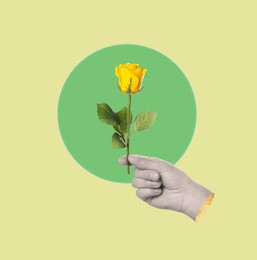 Image of Man holding rose in hand on bright background. Creative art design